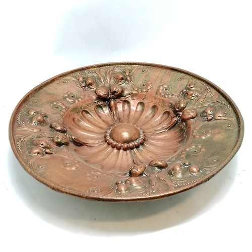 221 - Antique continental large copper charger, with all over floral and fruit decoration. 53 cm diameter,... 