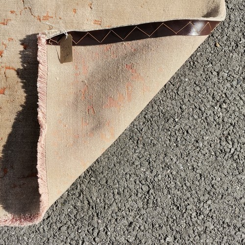 341 - Rust Ground with allm over beige pattern, 175 cm wide 240 cm length, in good condition.