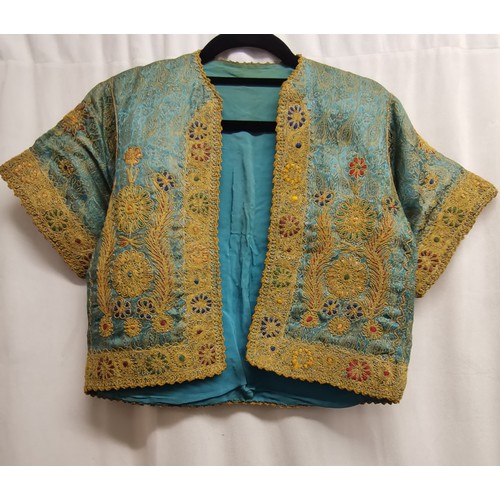 91 - Oriental embroidered short sleeved blue silk jacket with gold embroidered decoration in good conditi... 