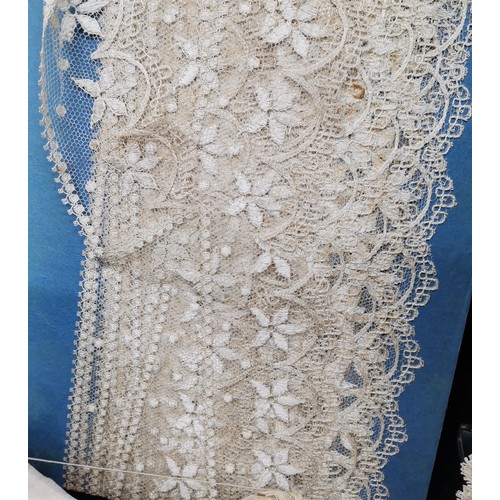 115 - A lot of lace and fabric trims to include satin embroidered with silver thread and red trim