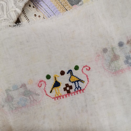 115 - A lot of lace and fabric trims to include satin embroidered with silver thread and red trim