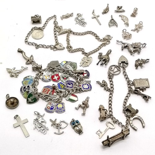 519 - 4 x silver charm bracelets inc unmarked with multiple enamel shield charms (inc 800 silver) t/w loos... 