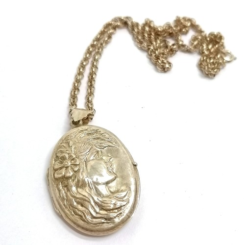 521 - Silver hallmarked Art Nouveau style locket with ladies head detail on a silver 44cm chain - 16g