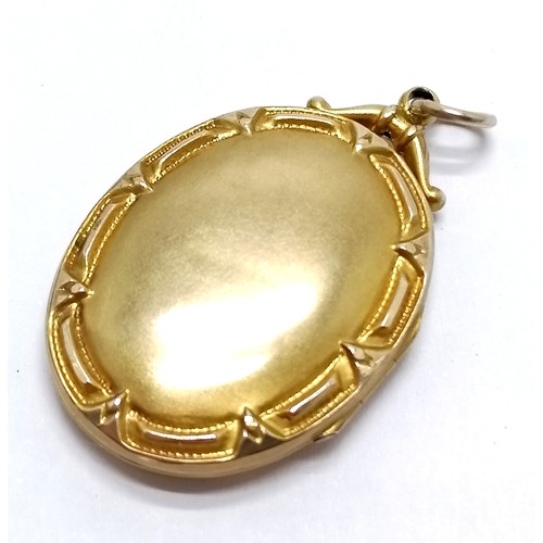 533 - Antique gilt metal locket pendant set with red stones & seed pearls - 3.5cm ~ slight dents to revers... 