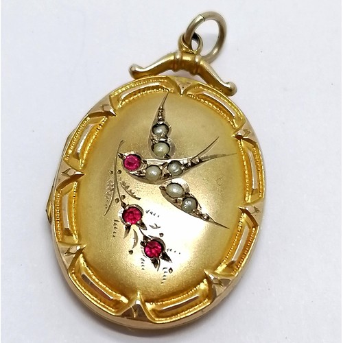 533 - Antique gilt metal locket pendant set with red stones & seed pearls - 3.5cm ~ slight dents to revers... 