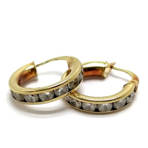 534 - 9ct marked gold hoop earrings channel set with white stones - 2.6g total weight