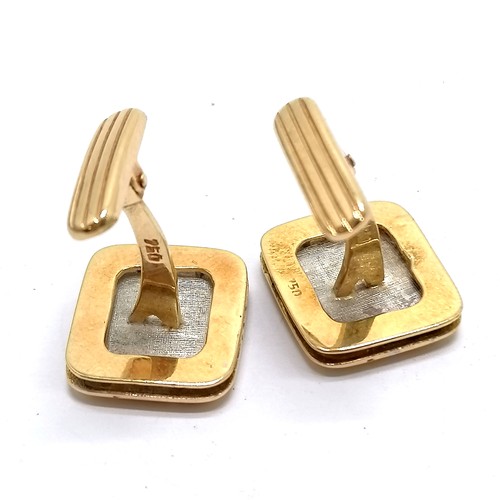 577 - 18ct marked gold cufflinks with white gold centres surrounded with screwed frame - 12.8g total