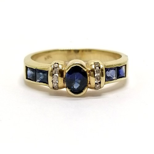 783 - 14ct gold marked sapphire and diamond ring with channel set diamond detail and princes cut sapphire ... 