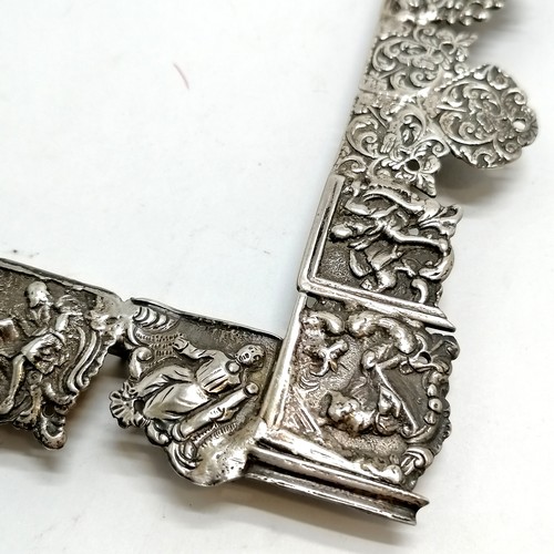 879 - Antique unmarked continental silver frame with unusual construction of cast panels depicting figural... 