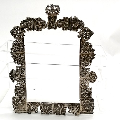 879 - Antique unmarked continental silver frame with unusual construction of cast panels depicting figural... 