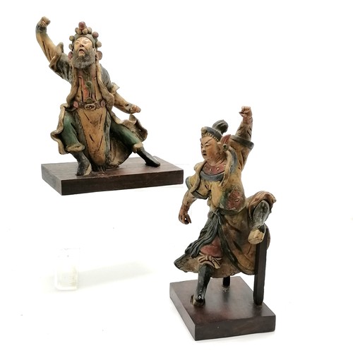 28 - Antique pair of Oriental pottery glazed figures (appear to have been part of a larger piece) on wood... 