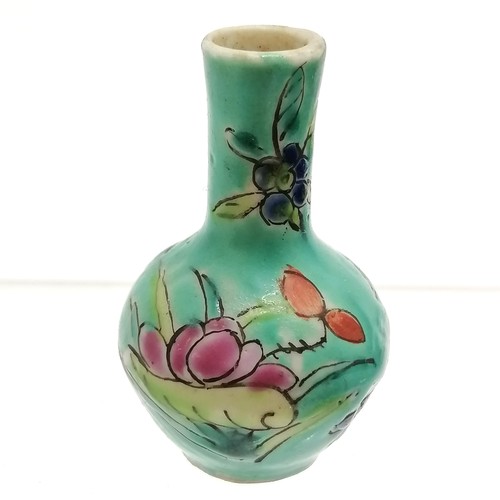 37 - Chinese miniature vase with floral decoration on a blue green ground - 5cm high