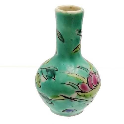 37 - Chinese miniature vase with floral decoration on a blue green ground - 5cm high