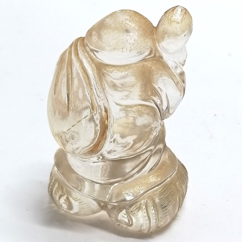 43 - Oriental carved rock crystal figure of a man carrying a sack on a wooden base - total height 8.5cm a... 