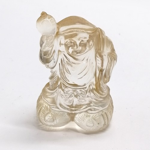 43 - Oriental carved rock crystal figure of a man carrying a sack on a wooden base - total height 8.5cm a... 