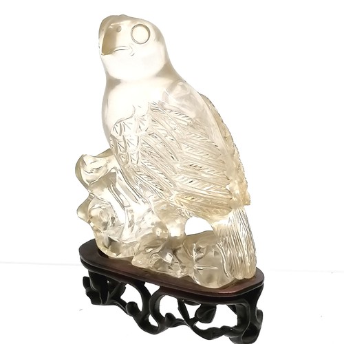 44 - Oriental carved rock crystal figure of a bird of prey on a hand carved wooden stand - total height 1... 