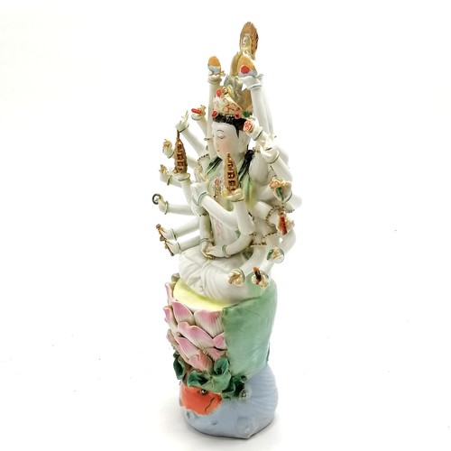 59 - Chinese republic period porcelain figure of deity with 24 arms seated on a lily pad with carp & wate... 