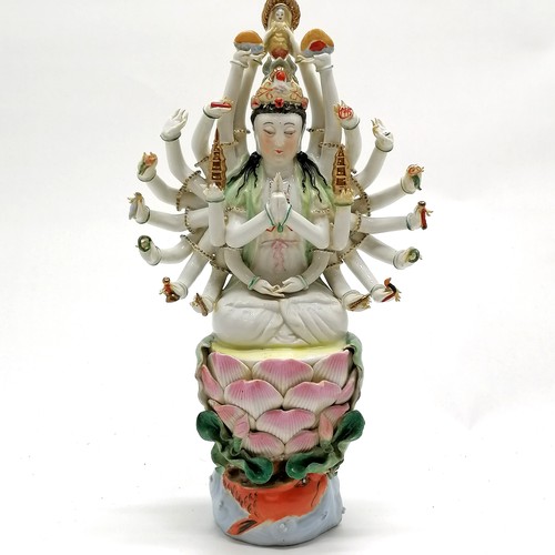 59 - Chinese republic period porcelain figure of deity with 24 arms seated on a lily pad with carp & wate... 