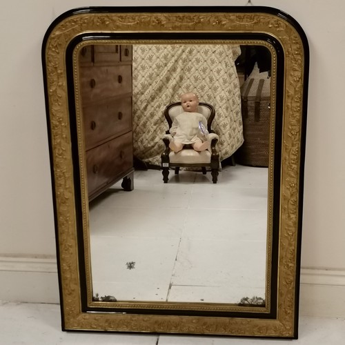 128 - Antique gilt and ebonised framed over mantle mirror, with foxing to the mirror plate, but otherwise ... 