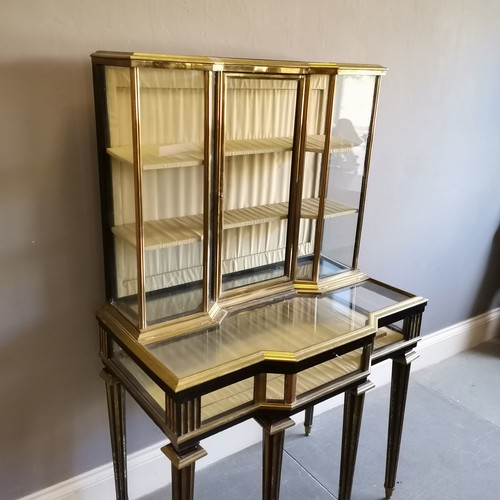 143 - Antique Continental Bijouterie cabinet, in ebonised wood with brass veneer detailing, The top sectio... 