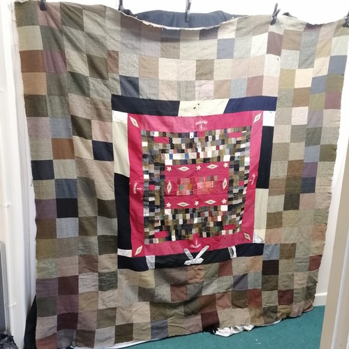 176 - WWI wool patchwork cover with Hereford uniform badges and other badges. In mostly good condition, so... 