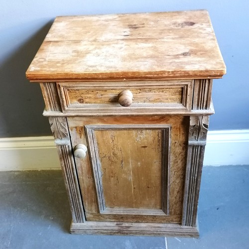 187 - Antique pine bedside cupboard, with carved decoration, single frieze drawer with cupboard under, hea... 