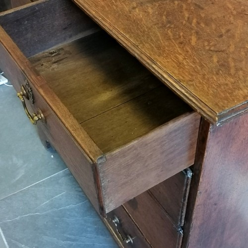 195 - Antique oak chest of 2 short and 3 long graduated drawers, with brass drop handles on bracket feet, ... 