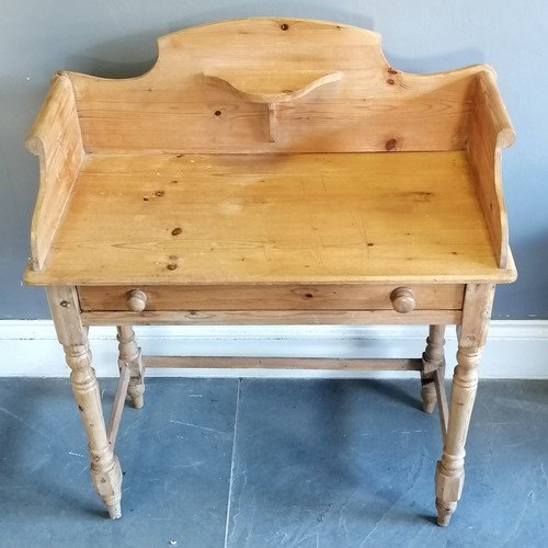 203 - Antique pine washstand with shaped gallery rail, single frieze drawer on turned column supports, in ... 