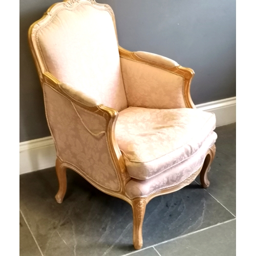 214 - French style salon chair, limed oak frame with carved decoration, upholstered in a pink damask, in u... 