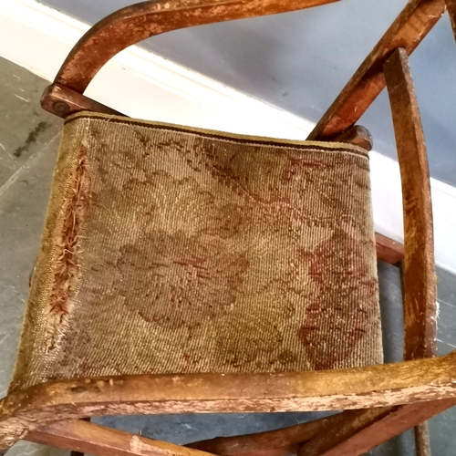 216 - Antique folding campaign chair with carpet seat, needing attention, in original condition, 47 cm wid... 