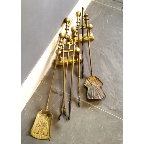 223 - Vintage brass fire irons, and another set similar, t/w pair of brass fire dogs.