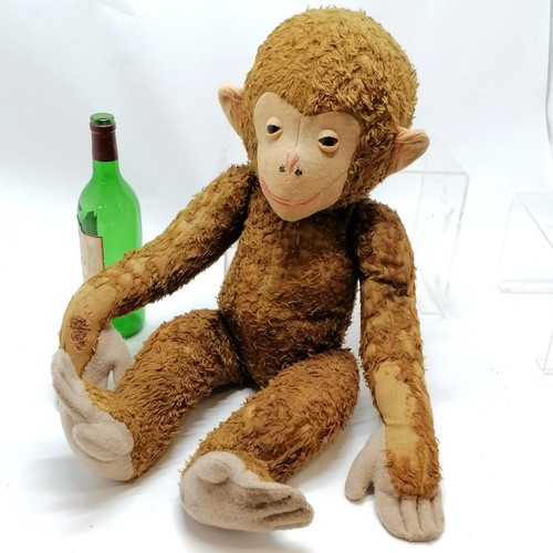 228A - Large antique straw filled jointed monkey (Schuco?) with felt detail - 65cm high with some love worn... 