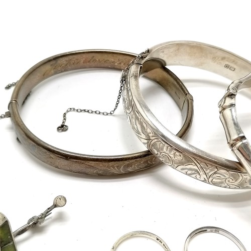 307 - 3 x silver bangles - plain one has dedication to inside & safety chains a/f, 2 antique brooches - (t... 