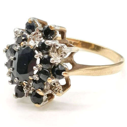 324 - 9ct hallmarked gold sapphire (15) & diamond (6) cluster ring - size S & 5g total weight