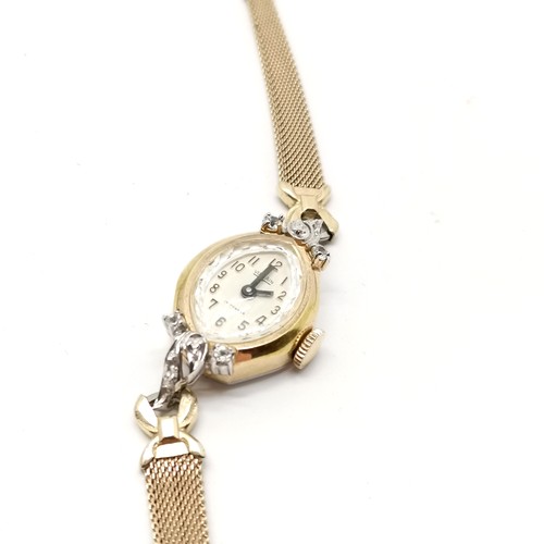 349 - Vulcain ladies watch, gold tone bracelet, pearl earrings & strand of pearls with silver clasp