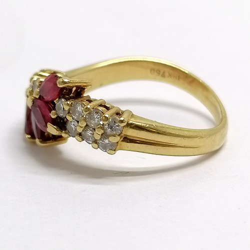 371 - 18ct hallmarked gold ruby (5) & diamond (11) set ring - size M½ & 4.3g total weight