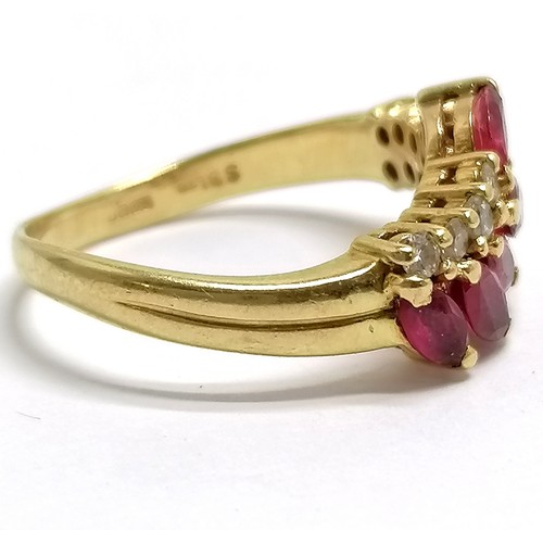 371 - 18ct hallmarked gold ruby (5) & diamond (11) set ring - size M½ & 4.3g total weight