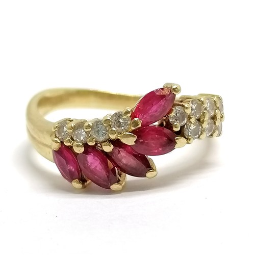 371 - 18ct hallmarked gold ruby (5) & diamond (11) set ring - size M½ & 4.3g total weight