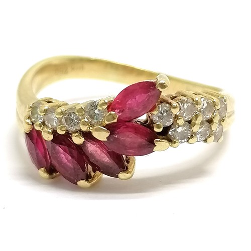 371 - 18ct hallmarked gold ruby (5) & diamond (11) set ring - size M½ & 4.3g total weight