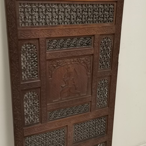 37 - Indian carved & fretwork decorated teak panel with central panel depicting Indian goddess - 61cm wid... 