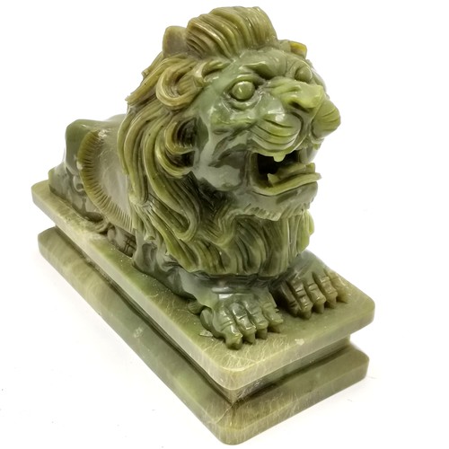 246 - Carved green stone statue of a recumbent lion (15cm x 12cm high) t/w Oriental carved hardstone conce... 