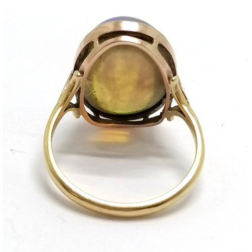 375 - 9ct marked gold cabochon opal stone set ring - size P½ & 4.8g total weight ~ stone has light surface... 