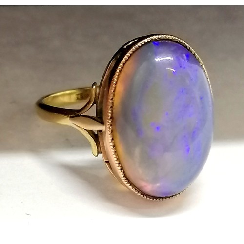 375 - 9ct marked gold cabochon opal stone set ring - size P½ & 4.8g total weight ~ stone has light surface... 