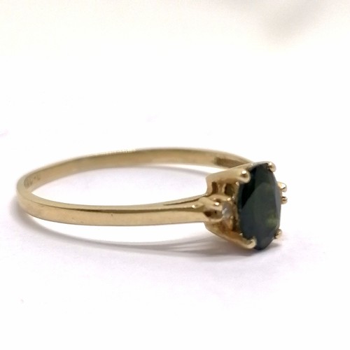 405 - 14ct marked gold diamond & dark green stone ring - size O & 1.1g total weight - SOLD ON BEHALF OF TH... 