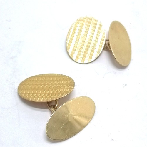 417 - 9ct hallmarked gold pair of oval cufflinks with engine turned detail - 3.6g - SOLD ON BEHALF OF THE ... 