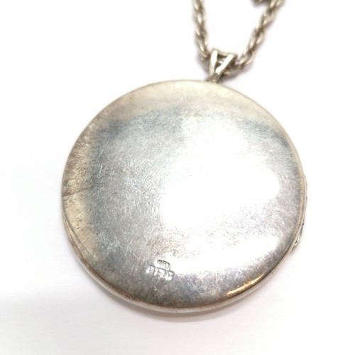 435 - Large silver locket with engraved detail to front (4cm) on a silver 44cm chain - total weight 26g ~ ... 