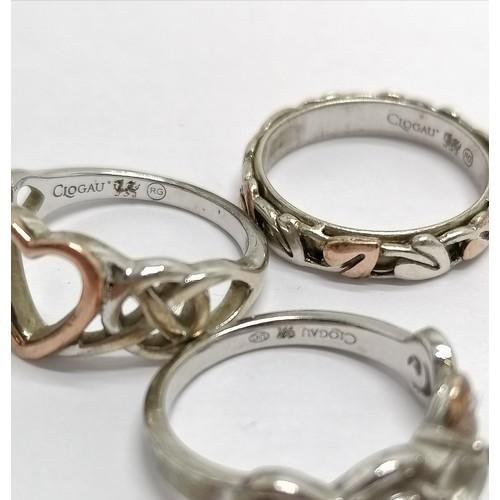 438 - 3 x Clogau silver / Welsh gold rings inc heart shaped, Cariad etc - sizes J-L t/w retail ring box & ... 