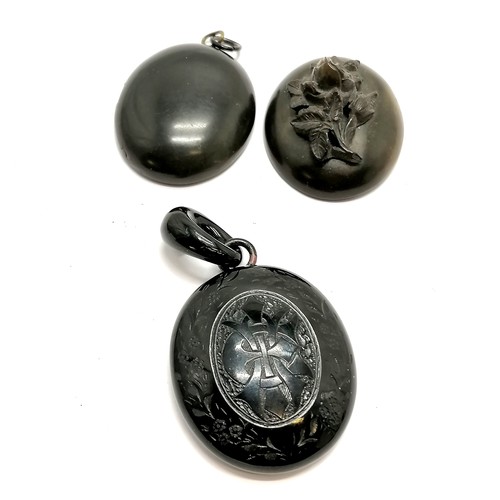 448 - Antique hand carved jet pendant with glass cameo centre detail (total drop 6.5cm - lacks glass?) t/w... 