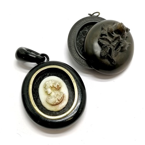 448 - Antique hand carved jet pendant with glass cameo centre detail (total drop 6.5cm - lacks glass?) t/w... 