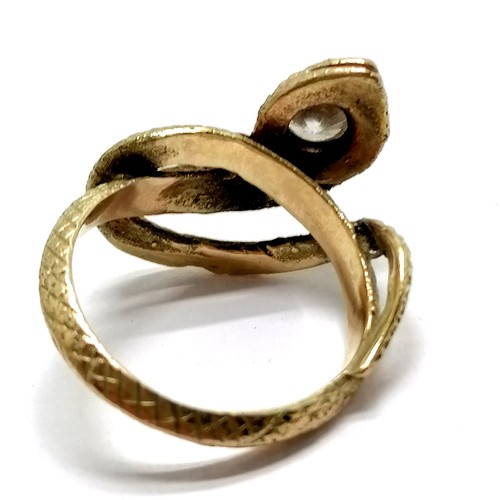 505 - Unmarked gold snake ring set with white stone to head - size L½ & 4.7g total weight - SOLD ON BEHALF... 